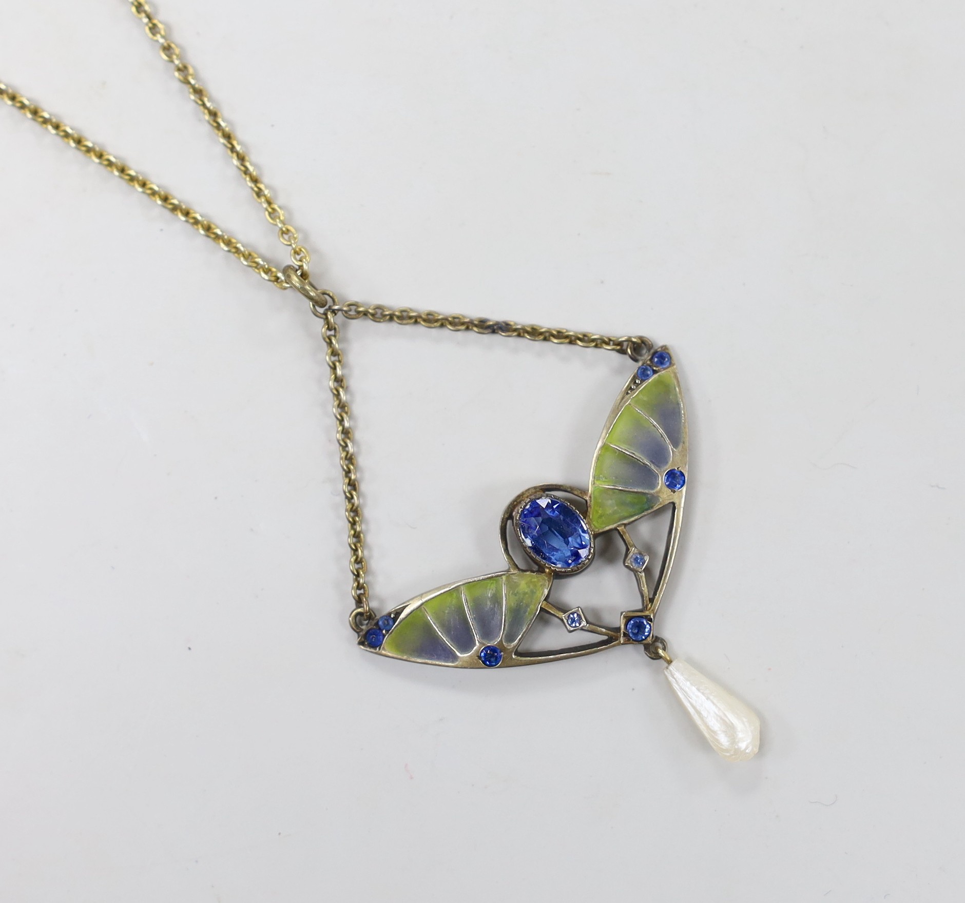 An early 20th century 800 gilt white metal, blue paste, plique a jour and freshwater pearl set drop pendant, width 41mm, on a 925 chain 47cm.